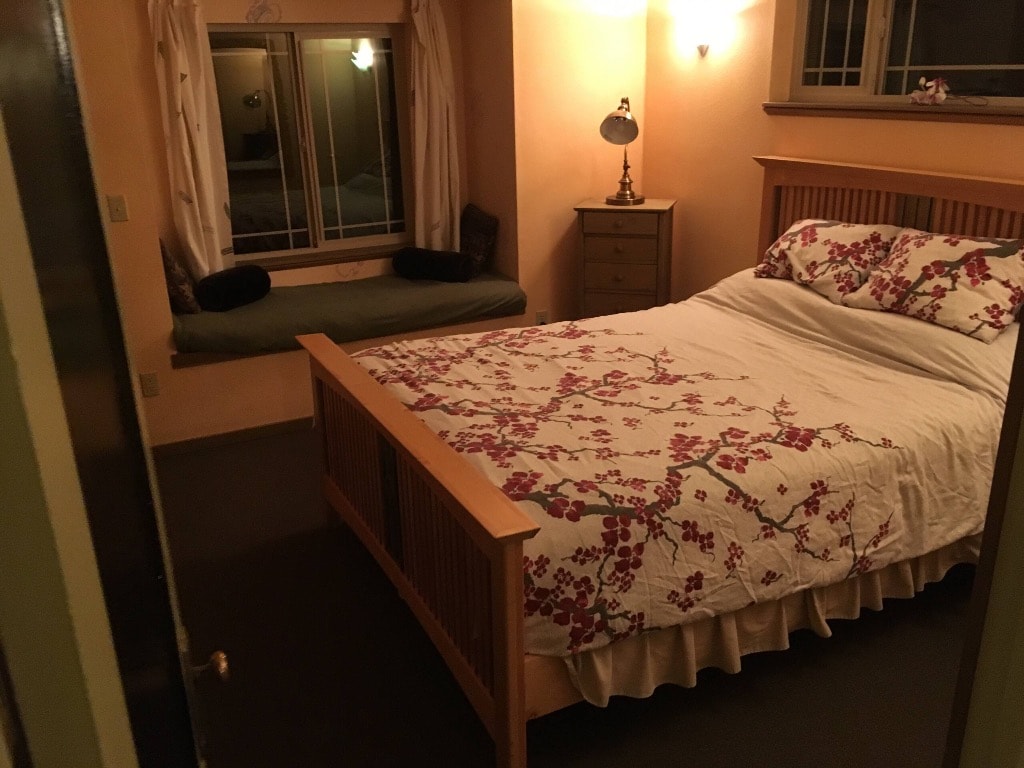 Queen bedroom with cherry blossom bedding
