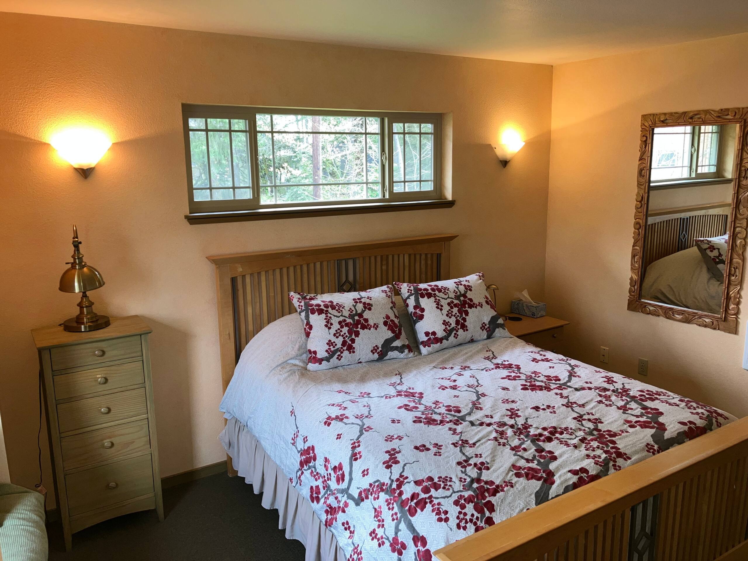Queen bedroom with garden window and window seat