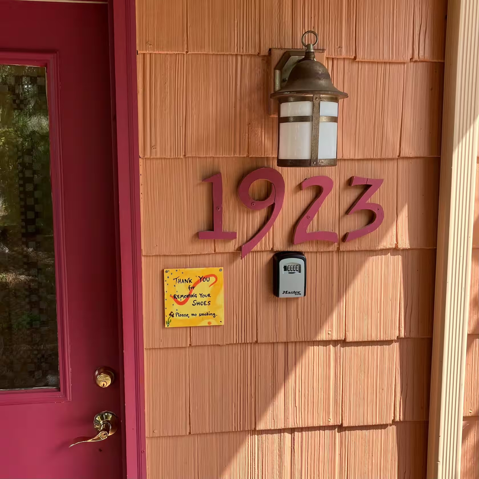 Cottage front door with house number 1923