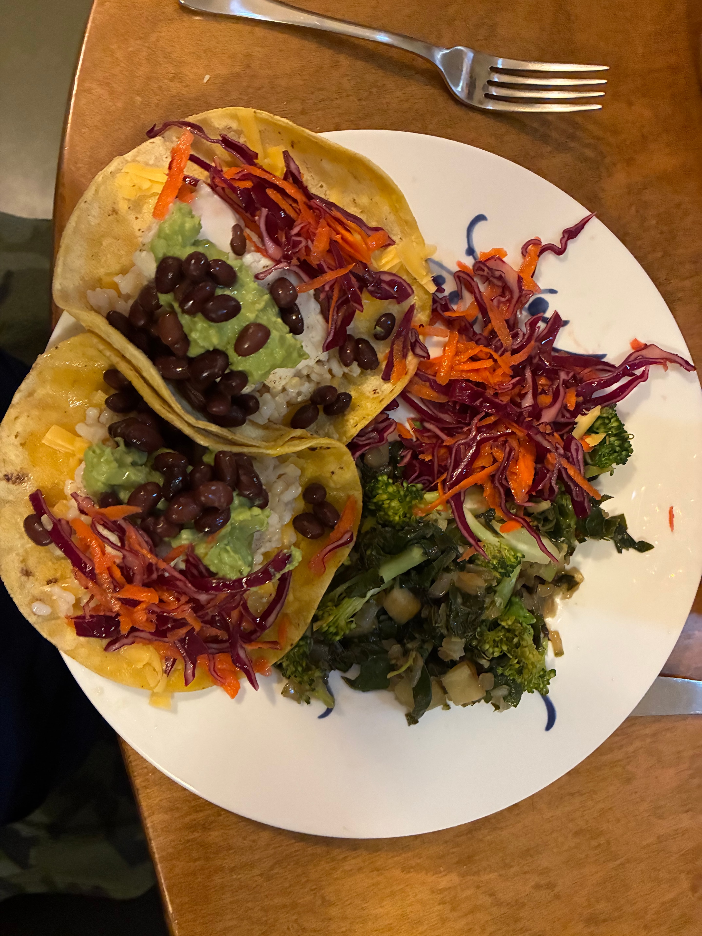Colourful tacos with black beans, guacamole and slaw